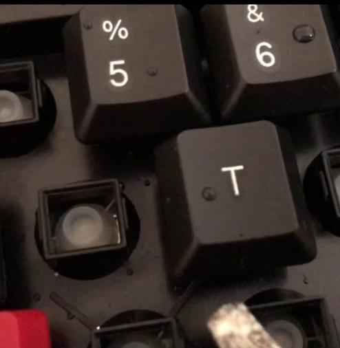 Popping Off Keys to Clean a Keyboard